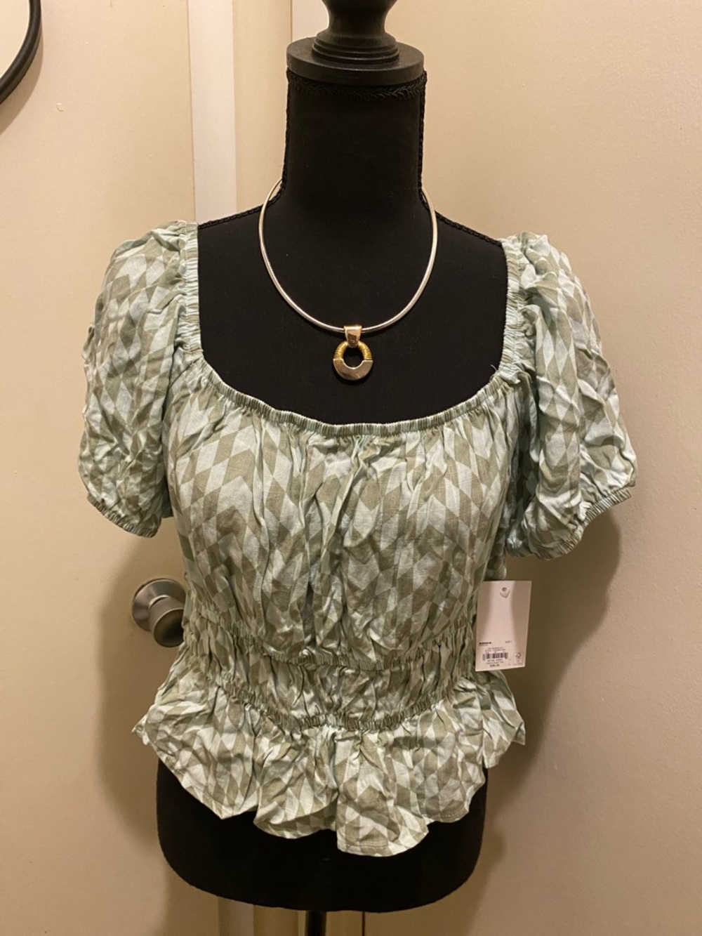 D) SO Goods For Life Sage Diamond Smocked Peplum Puff-Sleeve Top.  Size L